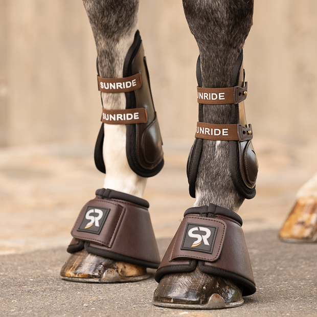 brown leather jumping boots with elastic straps and safety net layer and matching leather bell boots neoprene inside leather bell boots brown with neoprene inside and leather jumping boots brown with neoprene inside and elastic straps and safety net layer by sunride