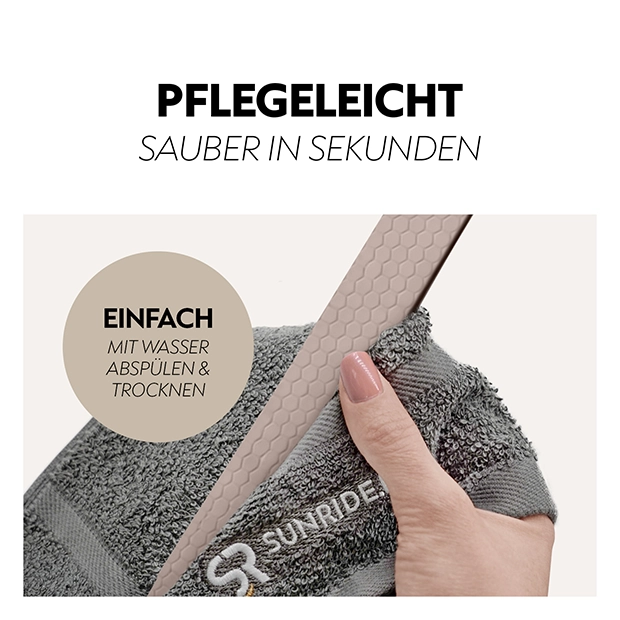 Ein Handgriff wird auf einem grauen Handtuch gehalten, das eine pflegeleichte Oberfläche zeigt, mit Text, der die einfache Reinigung mit Wasser beschreibt.