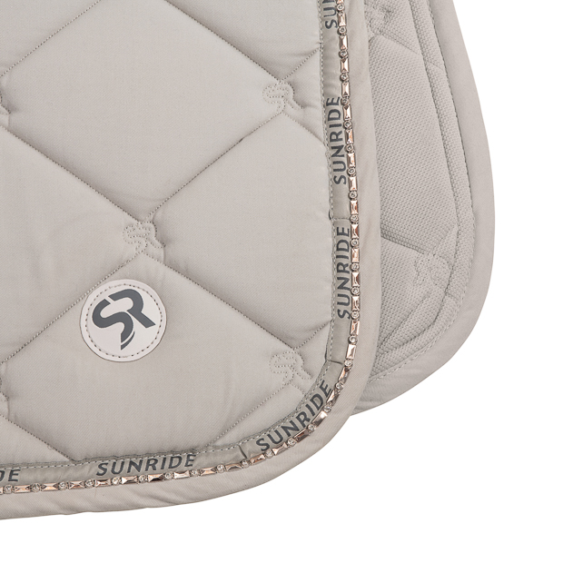 breathable dressage saddle pad wellington beige with detailed view of gemstones and fur on withers