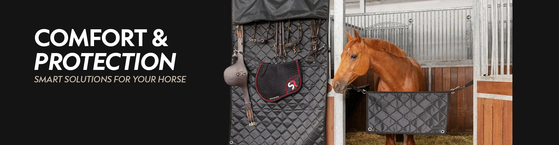 A black stall curtain is hanging on a horse box with a black saddle pad with a red border and a riding helmet attached on the right a brown horse is looking out of its box on the left the text reads Comfort and Protection smart solutions for your horse