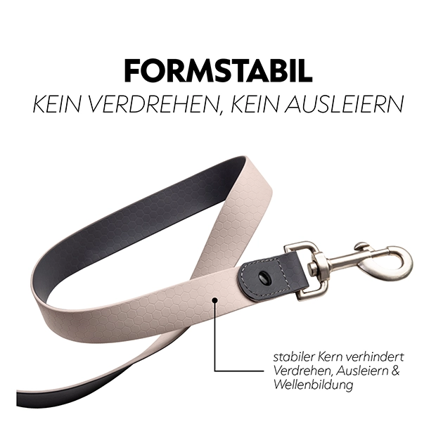 A beige dog leash with a hexagonal pattern and a sturdy clip, designed to prevent twisting and deformation during use.
