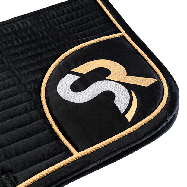 detailed view of embroidery on black golden sr line jumping saddle pad with breathable air mesh spine by sunride