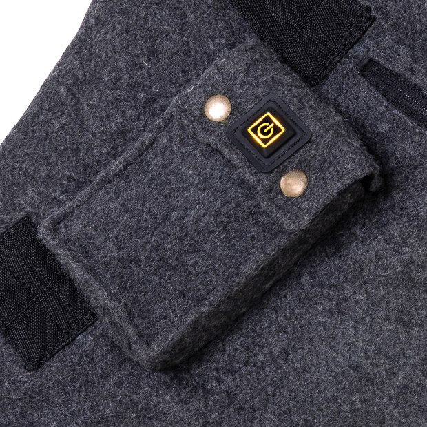 battery pocket of grey heating rug st. moritz from wool at low level heating detailed view of battery pocket and low level of heating of grey wool heating rug st. moritz with three levels of heating and program