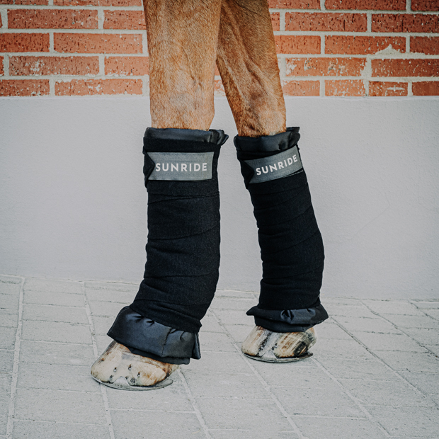 black stable bandages with reflectors and layers in set set of 2 black elastic stable bandages with reflectors and layers by sunride on a horse